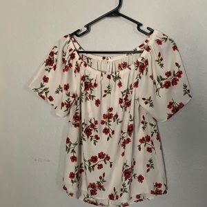 Off the shoulder cream and floral blouse